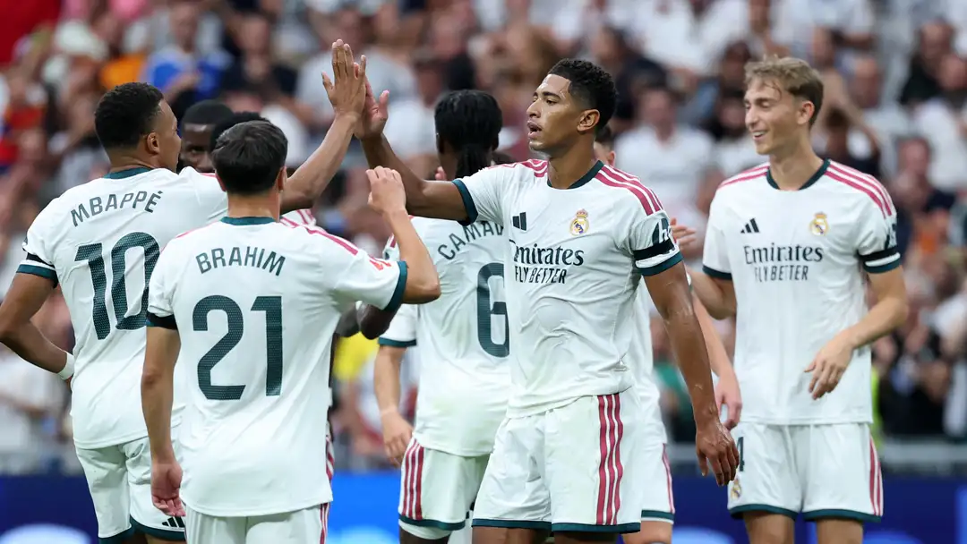Real Madrid players celebrate during their 4-0 La Liga victory over Malaga at the Santiago Bernabeu.