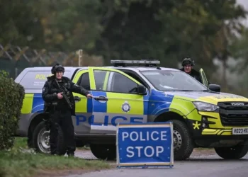 Police and security forces near RAF Fairford airbase in Gloucestershire after five men were arrested