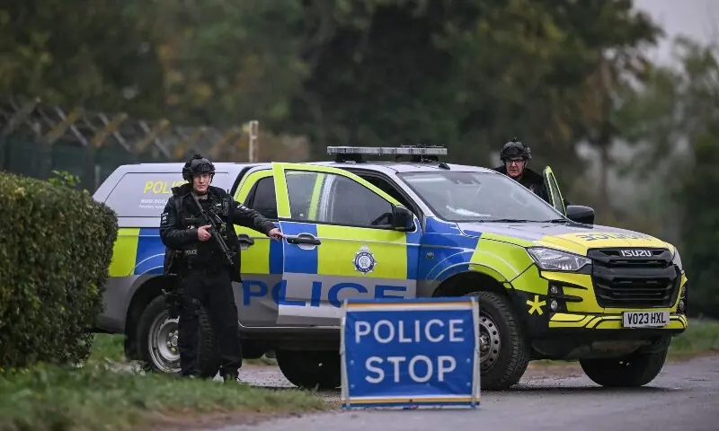 Police and security forces near RAF Fairford airbase in Gloucestershire after five men were arrested