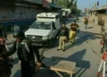 Police personnel at the scene of a traffic police vehicle attack in Tank district