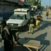 Police personnel at the scene of a traffic police vehicle attack in Tank district