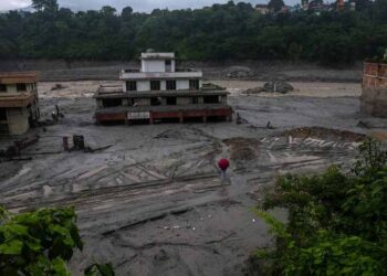 Rescue teams conducting operations after devastating floods and landslides in Nepal
