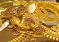 Gold bars and coins representing falling gold prices in Pakistan