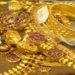 Gold bars and coins representing falling gold prices in Pakistan