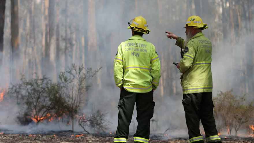 Australian firefighters conducting a controlled burn to reduce wildfire risk