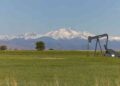 Oil infrastructure as crude prices fall amid US inventory and Saudi supply concerns.