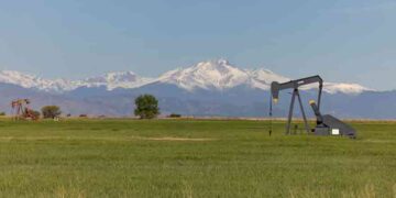 Oil infrastructure as crude prices fall amid US inventory and Saudi supply concerns.