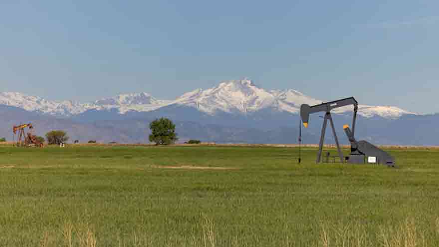 Oil infrastructure as crude prices fall amid US inventory and Saudi supply concerns.