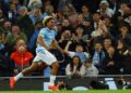 Floyd Samba celebrates scoring for Manchester City against Norwich City.