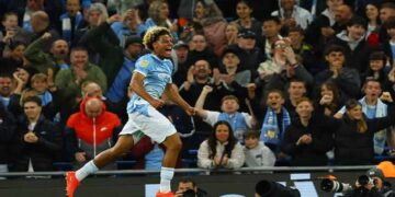 Floyd Samba celebrates scoring for Manchester City against Norwich City.