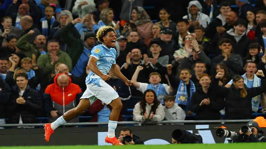 Floyd Samba celebrates scoring for Manchester City against Norwich City.