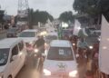 Citizens waving Pakistani flags during a Defence Day rally in Karachi