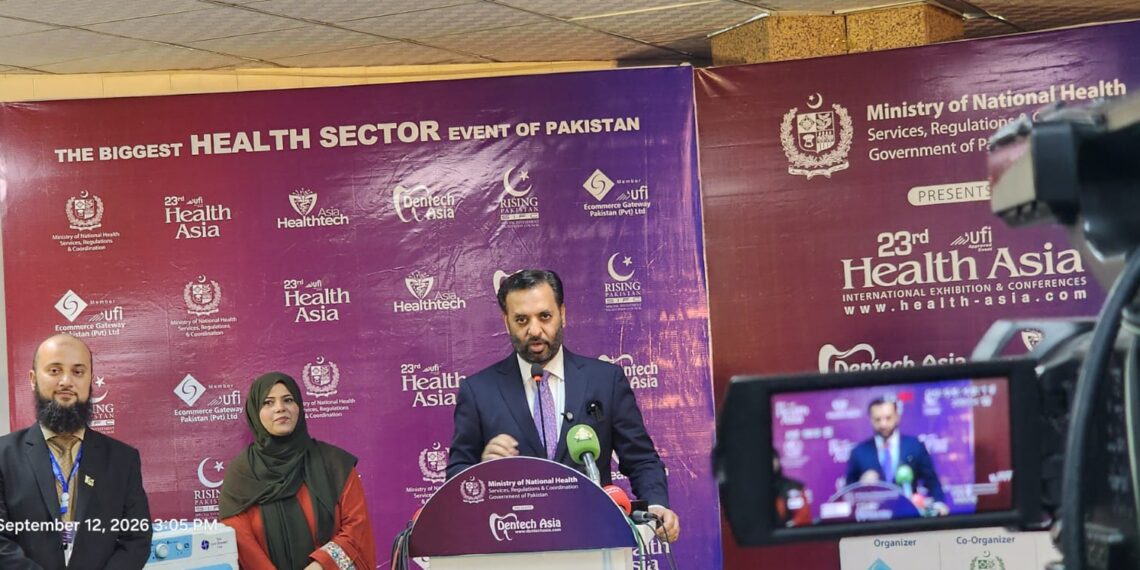Federal Minister Syed Mustafa Kamal views locally manufactured medical devices at the SSF conference in Karachi.