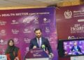 Federal Minister Syed Mustafa Kamal views locally manufactured medical devices at the SSF conference in Karachi.