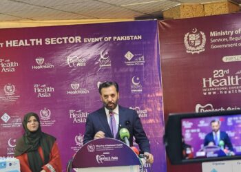 Federal Minister Syed Mustafa Kamal views locally manufactured medical devices at the SSF conference in Karachi.
