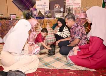 Students attend the Study in Malaysia Education Fair at Avari Towers Karachi.
