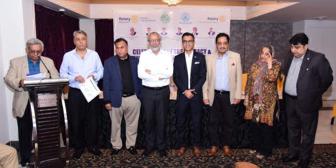 Rotary Club Karachi Nexus members and officials attend a Literacy Month meeting.