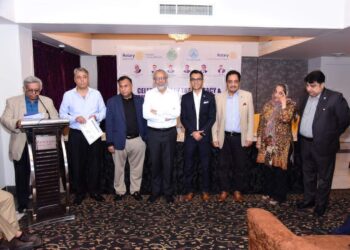 Rotary Club Karachi Nexus members and officials attend a Literacy Month meeting.