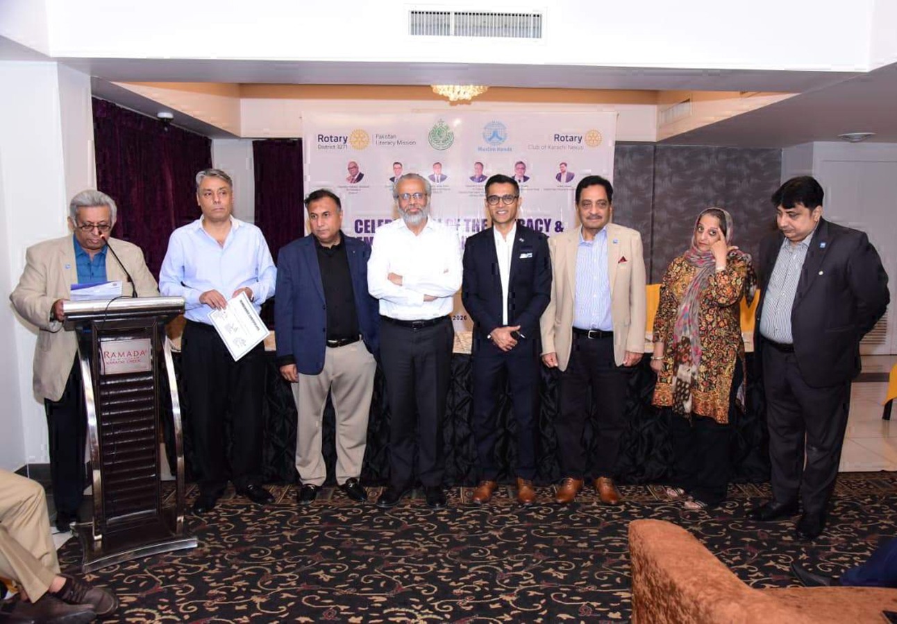 Rotary Club Karachi Nexus members and officials attend a Literacy Month meeting.