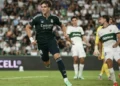 Real Madrid players celebrate after Carlos Espi scores the late winner against Elche.