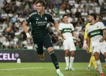 Real Madrid players celebrate after Carlos Espi scores the late winner against Elche.