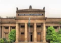 Gold bullion and Pakistani rupee notes amid market price changes