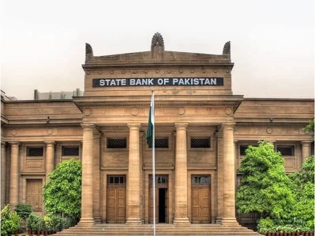 Gold bullion and Pakistani rupee notes amid market price changes