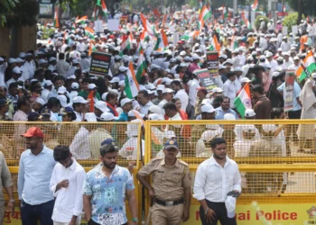 Indian police and barricades in New Delhi ahead of protests demanding the election chief’s resignation