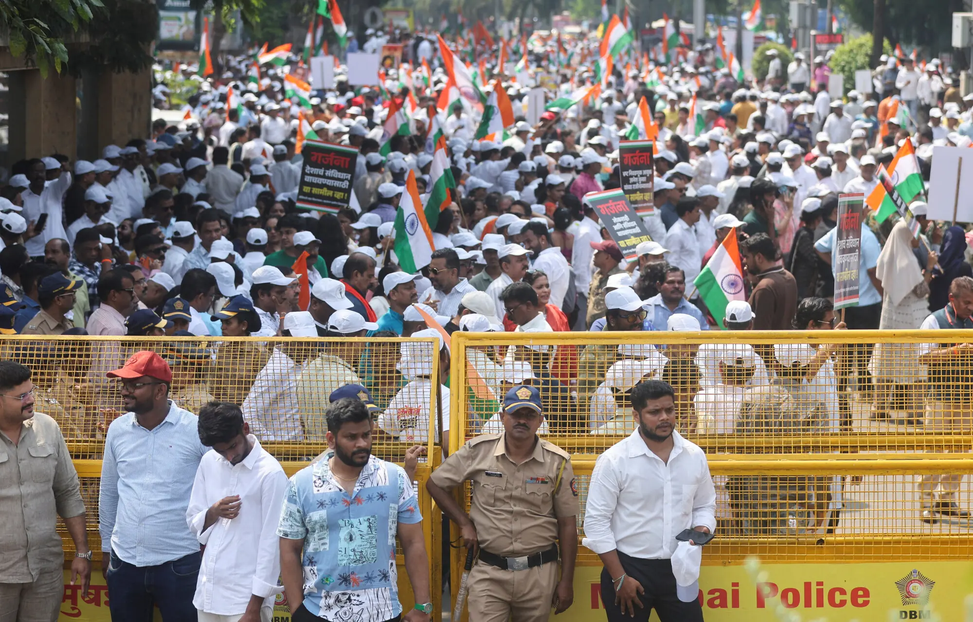 Indian police and barricades in New Delhi ahead of protests demanding the election chief’s resignation