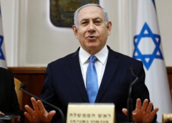 Gadi Eisenkot and Benjamin Netanyahu amid political tensions over Israel’s economy, potential sanctions and national security.
