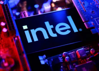 Intel semiconductor processor displayed against a technology-themed background amid a sharp decline in the company's stock price.