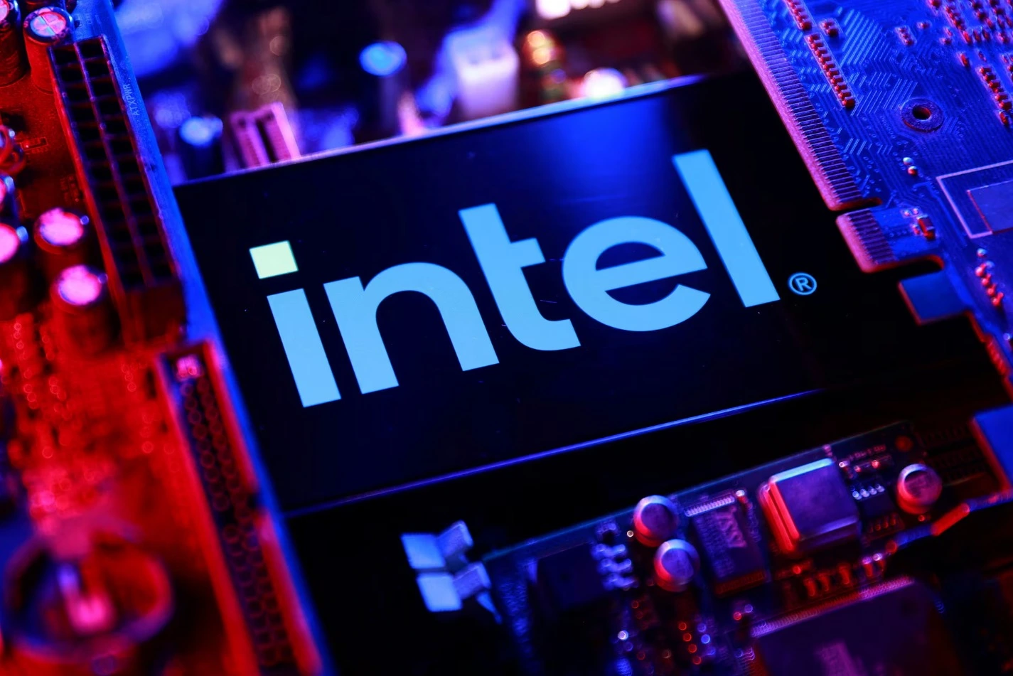 Intel semiconductor processor displayed against a technology-themed background amid a sharp decline in the company's stock price.