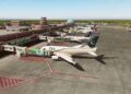 Passenger aircraft at an airport amid flight cancellations and delays affecting Pakistan and Saudi Arabia.