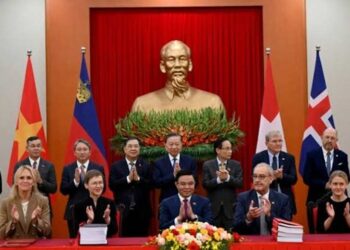Vietnam and EFTA representatives during the signing of a free-trade agreement in Hanoi.
