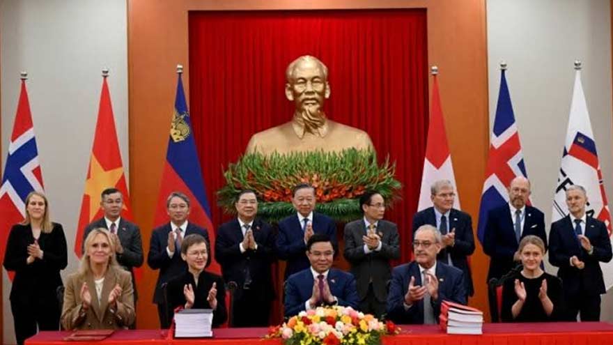 Vietnam and EFTA representatives during the signing of a free-trade agreement in Hanoi.