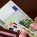 US dollar banknotes representing global currency markets amid euro weakness and financial uncertainty.