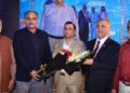 Brigadier Yaqoob Awan, Hanif Gohar, Atiq-ur-Rehman Allahwala and other guests pose for a commemorative photograph at a Karachi dinner. Photo: Muhammad Rizwan.