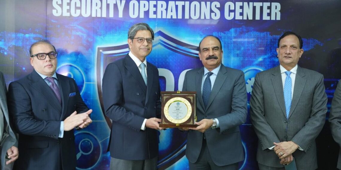 SECP officials and NADRA Chairman Lieutenant General Muhammad Munir Afsar at the Security Operations Centre inauguration in Islamabad.