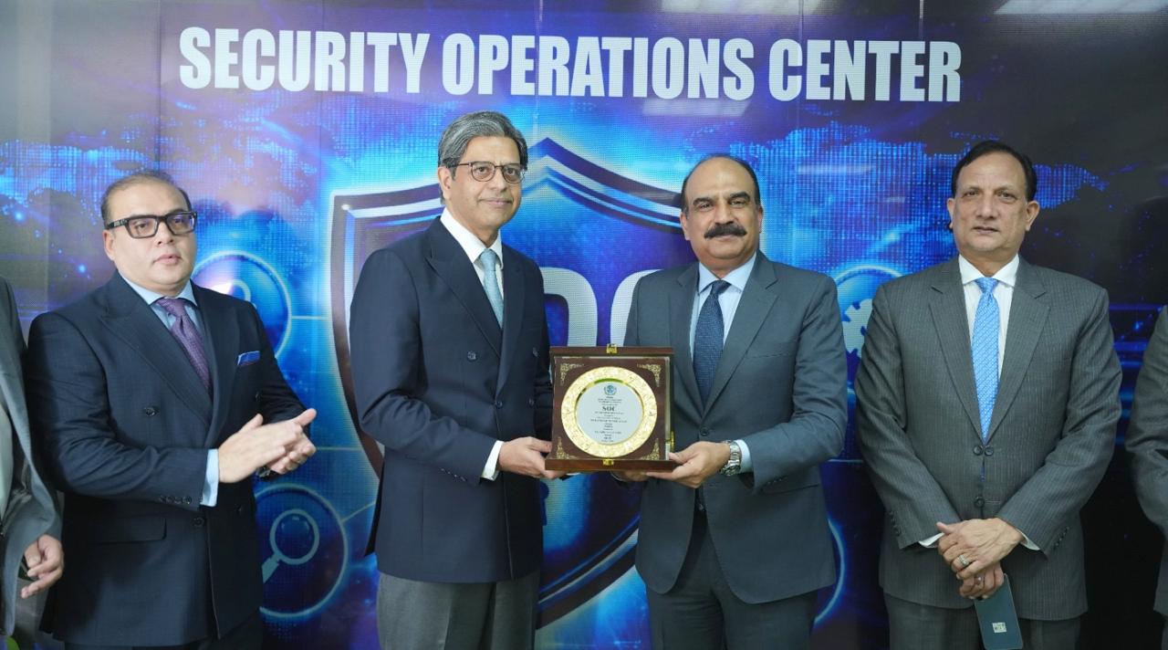 SECP officials and NADRA Chairman Lieutenant General Muhammad Munir Afsar at the Security Operations Centre inauguration in Islamabad.