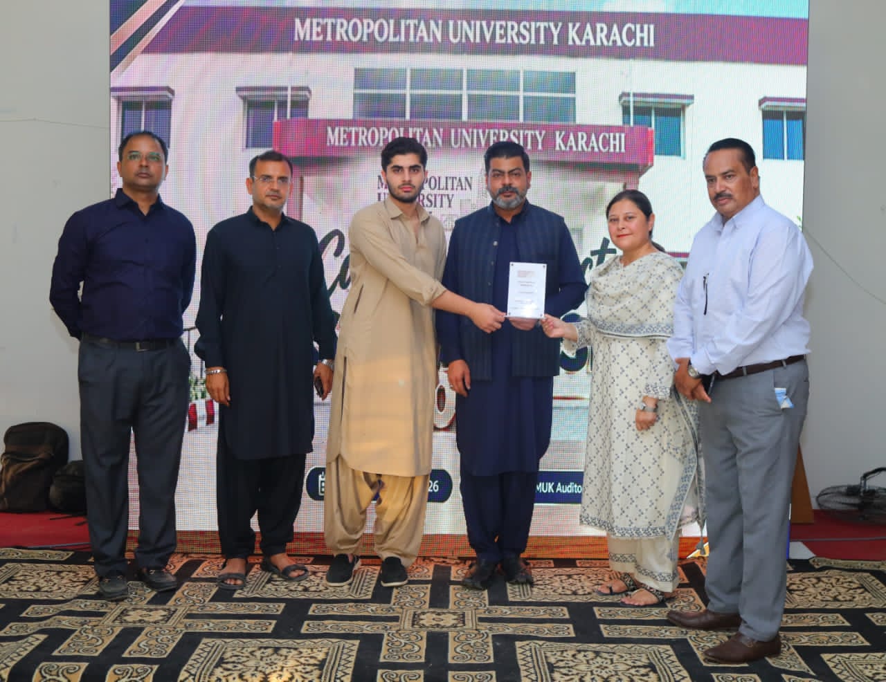 BBA students and university officials attend the Final Year Project Submission Ceremony at Metropolitan University Karachi.