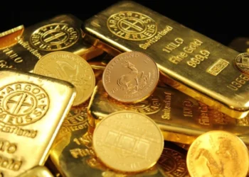 Gold bars and jewellery displayed at a market as gold prices fall in Pakistan.