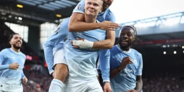 Manchester City players celebrate a goal during their Premier League match against Liverpool.