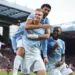Manchester City players celebrate a goal during their Premier League match against Liverpool.
