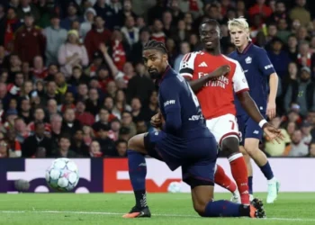 Arsenal players celebrate after scoring against Lille during their Champions League match in London.