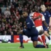 Arsenal players celebrate after scoring against Lille during their Champions League match in London.