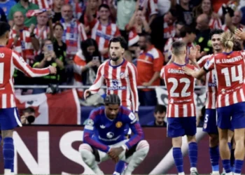 Atletico Madrid players celebrate after scoring against Manchester United in the Champions League.