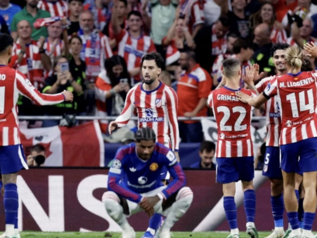 Atletico Madrid players celebrate after scoring against Manchester United in the Champions League.