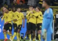 Borussia Dortmund players celebrate Maximilian Beier’s late winning goal against Eintracht Frankfurt in the Bundesliga.