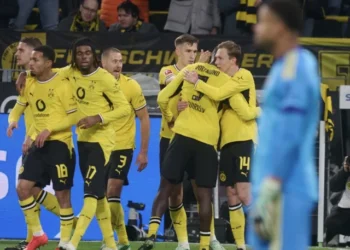 Borussia Dortmund players celebrate Maximilian Beier’s late winning goal against Eintracht Frankfurt in the Bundesliga.