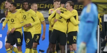 Borussia Dortmund players celebrate Maximilian Beier’s late winning goal against Eintracht Frankfurt in the Bundesliga.